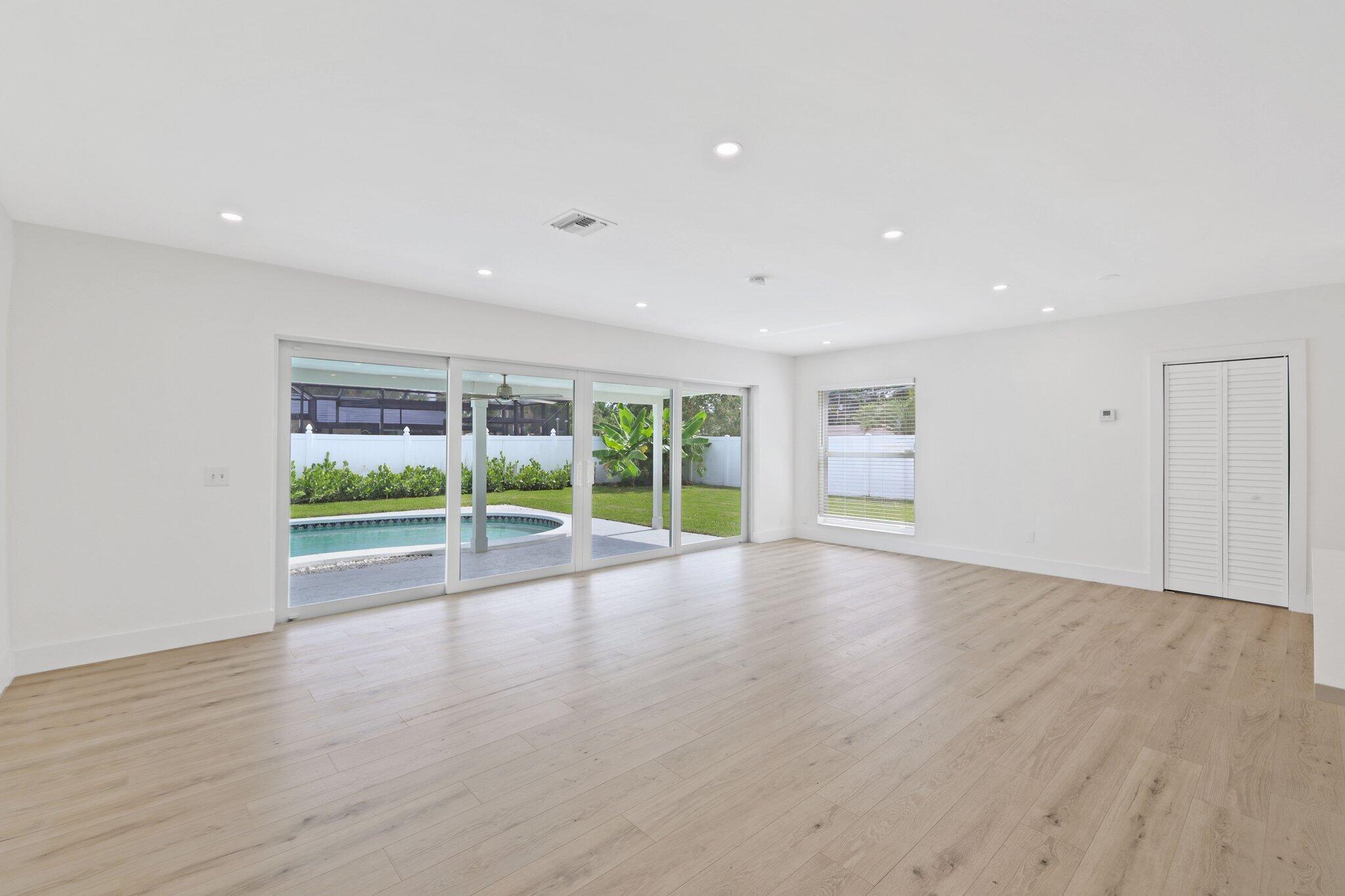 1198 Southwest 3rd Street Boca Raton, FL 33486 - Photo 5 of 29 a view of room with window and wooden floor