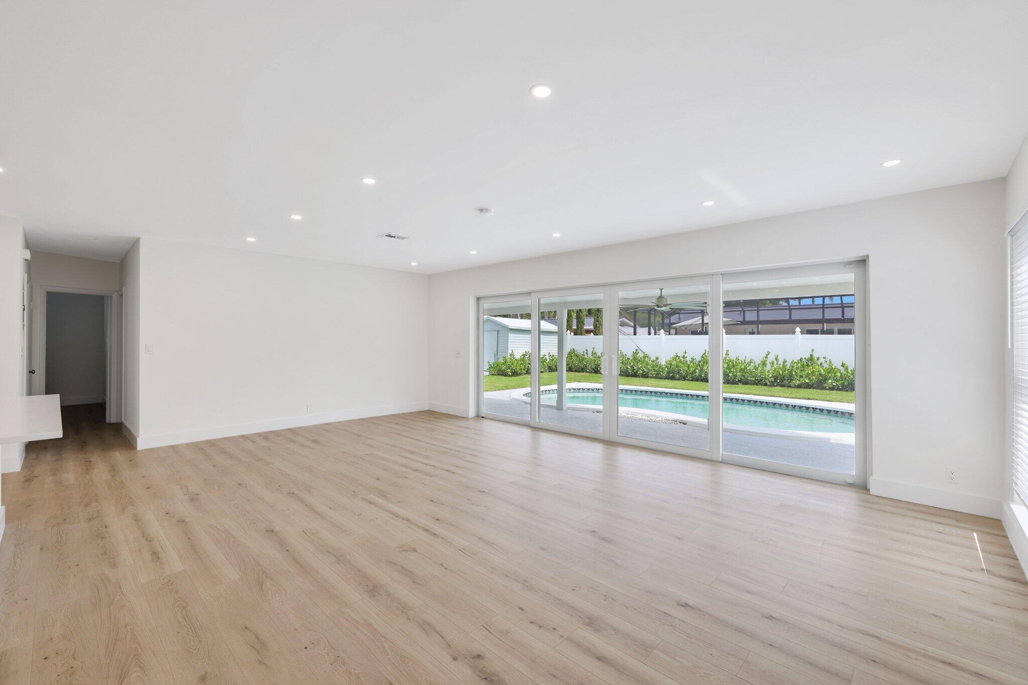 1198 Southwest 3rd Street Boca Raton, FL 33486 - Photo 6 of 29 a view of room with wooden floor and window