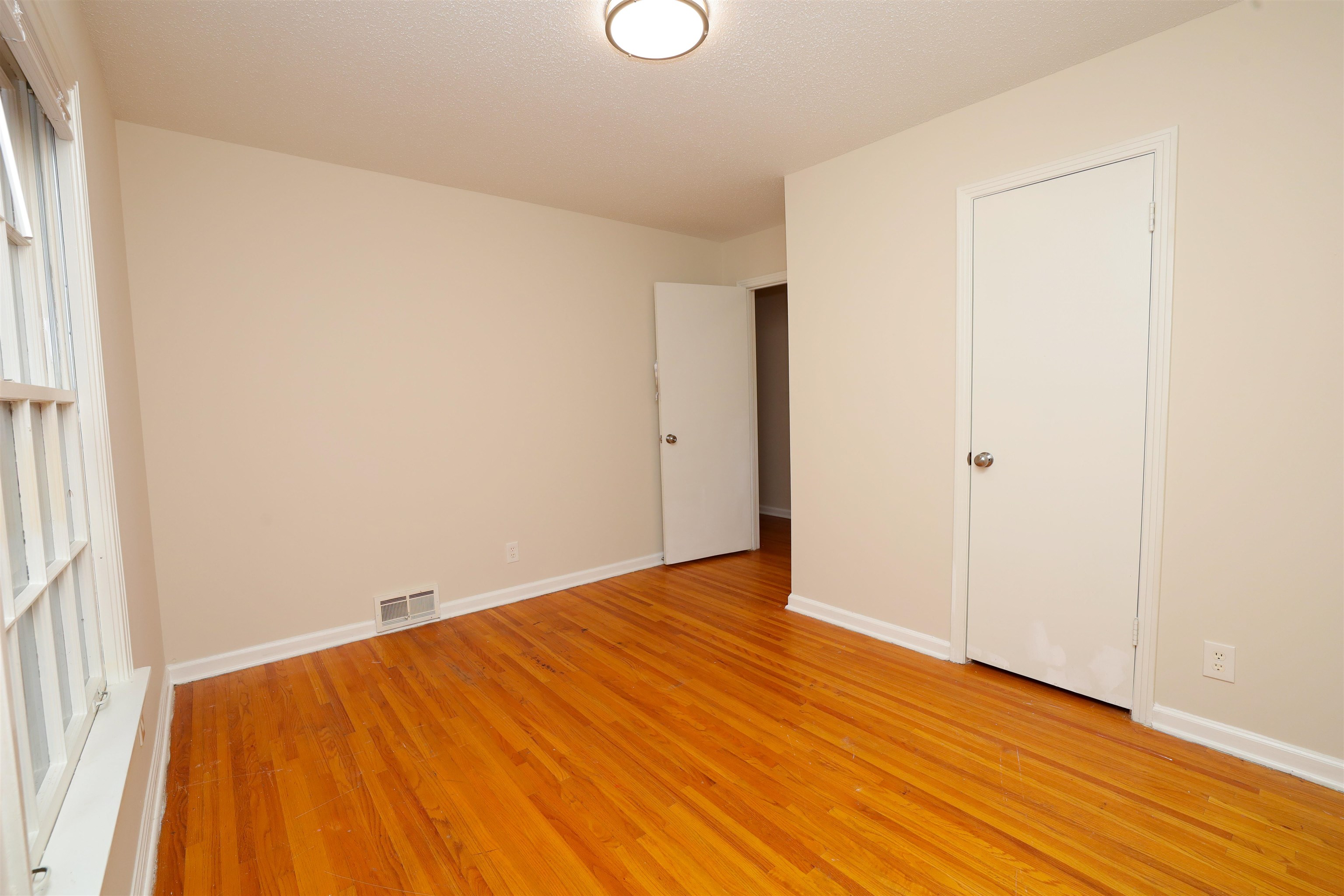 4843 Rolling Fields Drive Memphis, TN 38128 - Photo 12 of 22 Unfurnished bedroom featuring light hardwood / wood-style flooring