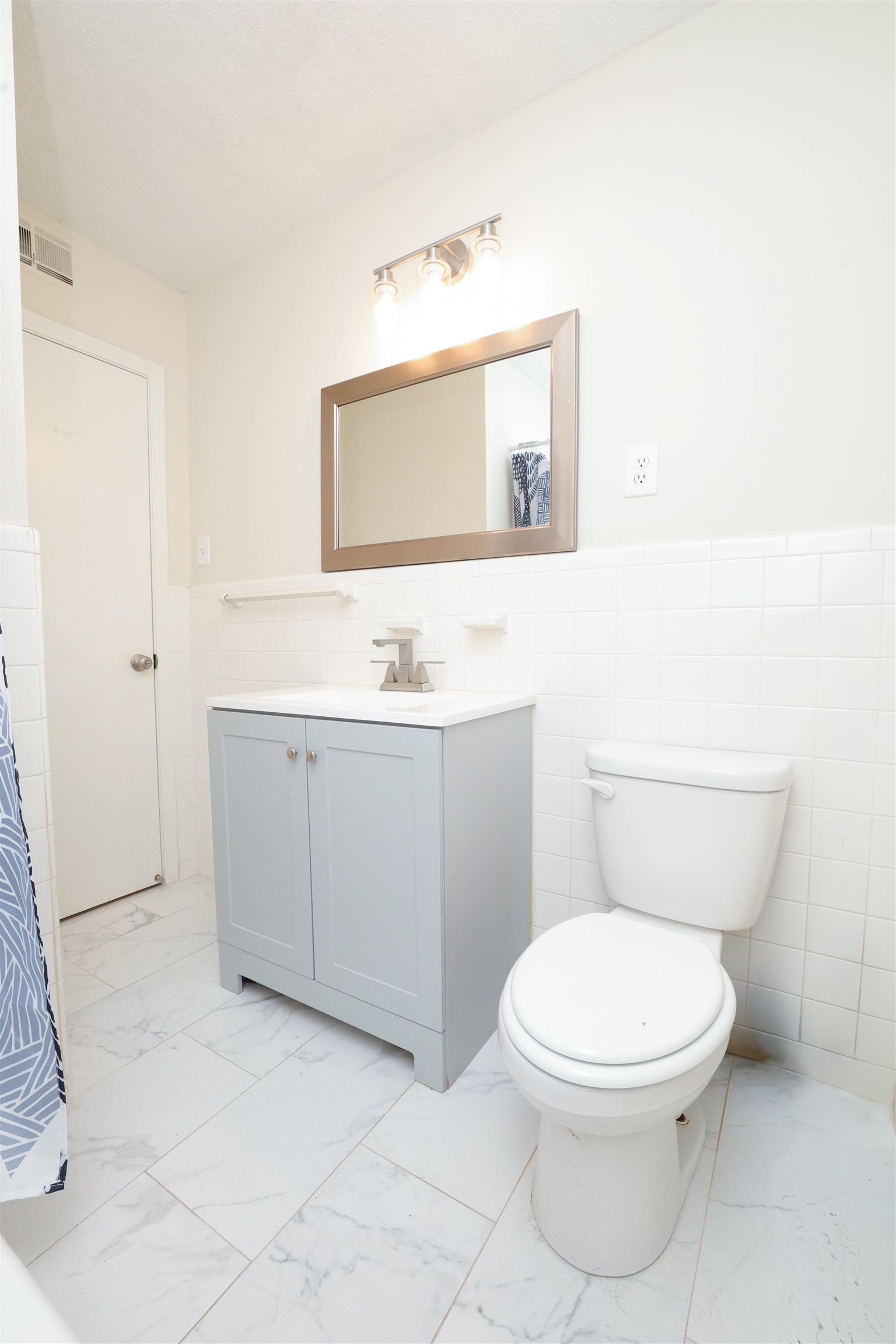 4843 Rolling Fields Drive Memphis, TN 38128 - Photo 13 of 22 Bathroom featuring vanity, toilet, and tile walls