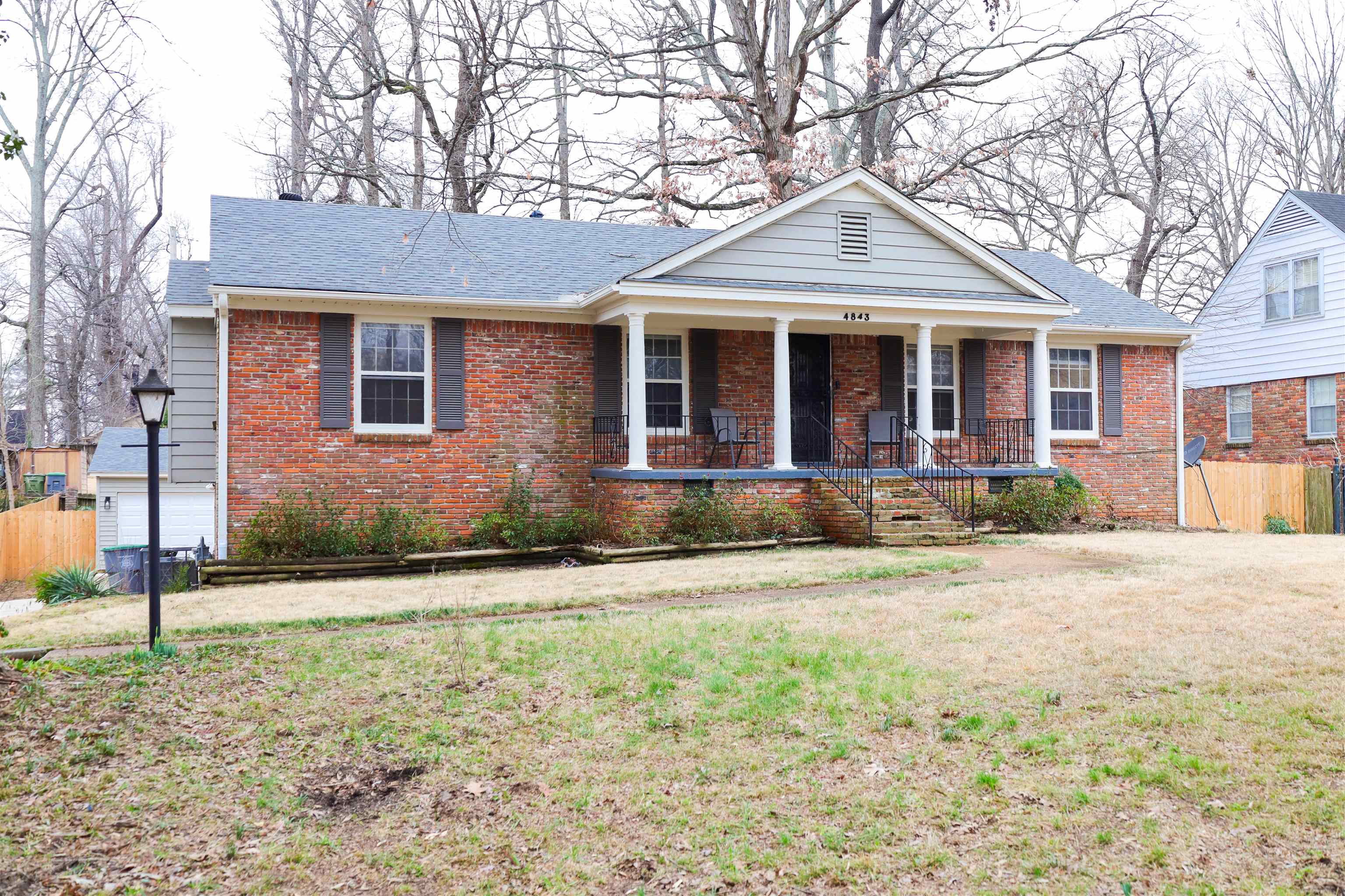 4843 Rolling Fields Drive Memphis, TN 38128 - Photo 3 of 22 View of front of house with a front lawn and covered porch