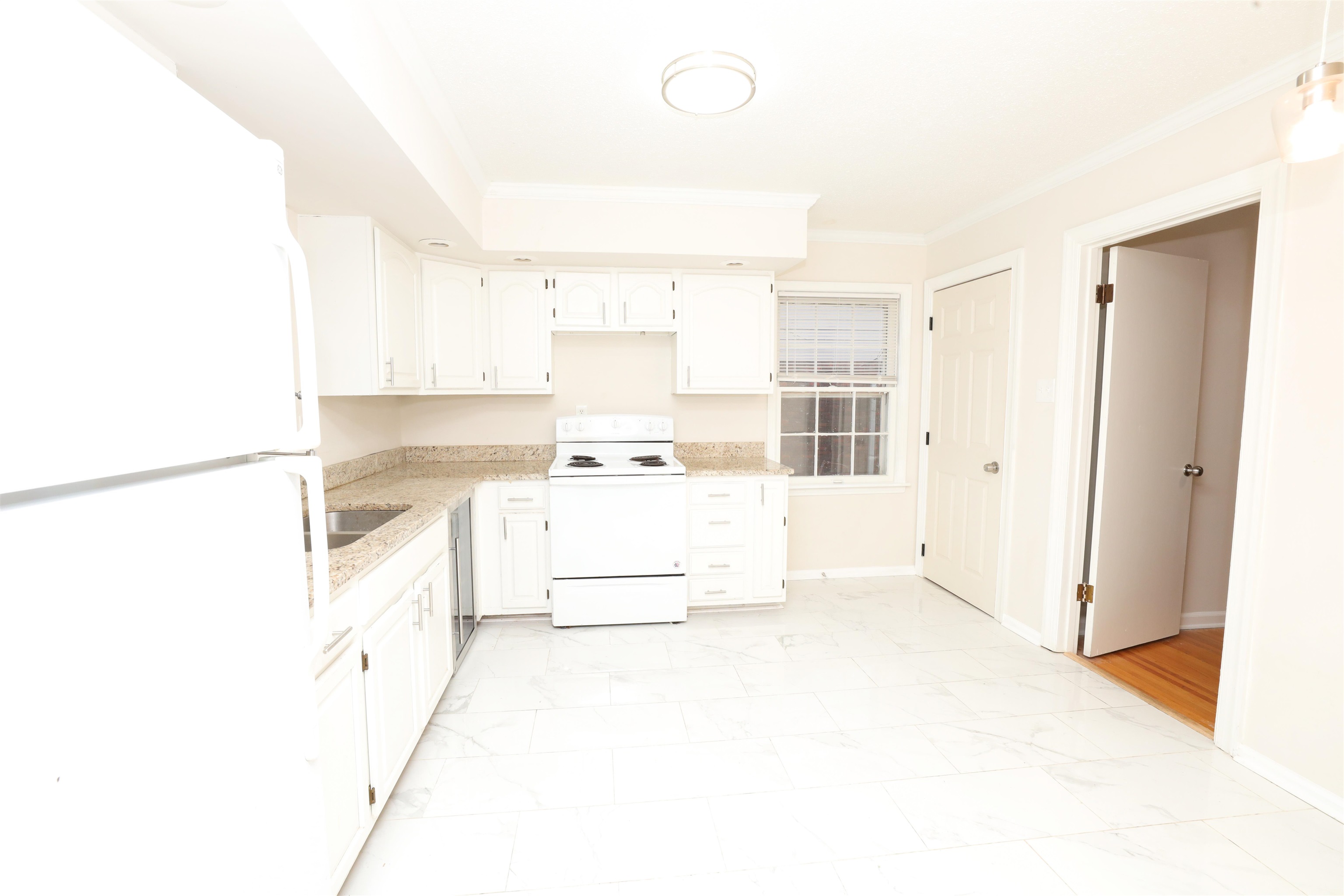4843 Rolling Fields Drive Memphis, TN 38128 - Photo 7 of 22 Kitchen with ornamental molding, sink, white cabinets, and white appliances