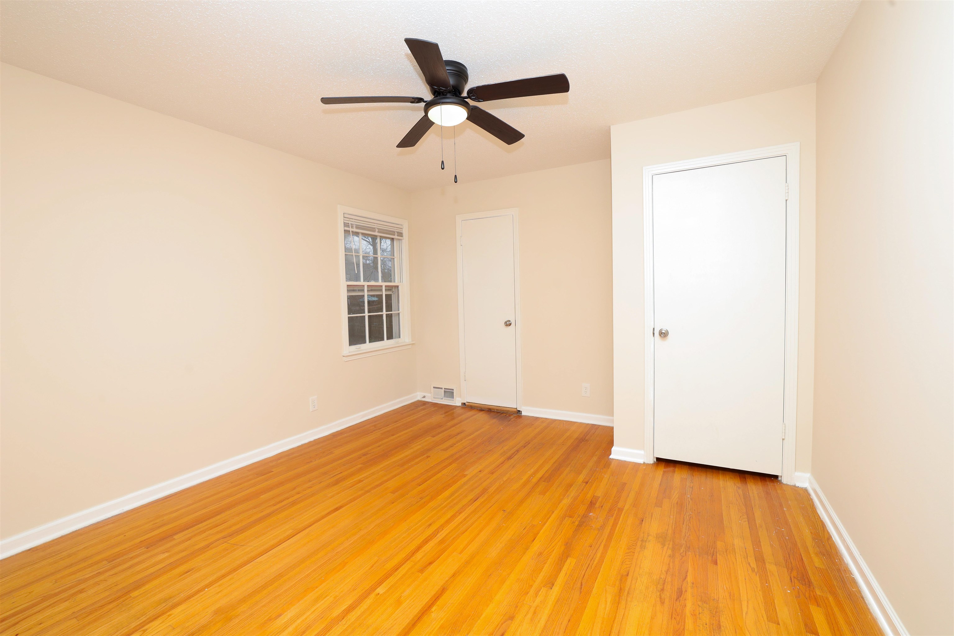 4843 Rolling Fields Drive Memphis, TN 38128 - Photo 9 of 22 Unfurnished room with ceiling fan and light hardwood / wood-style flooring