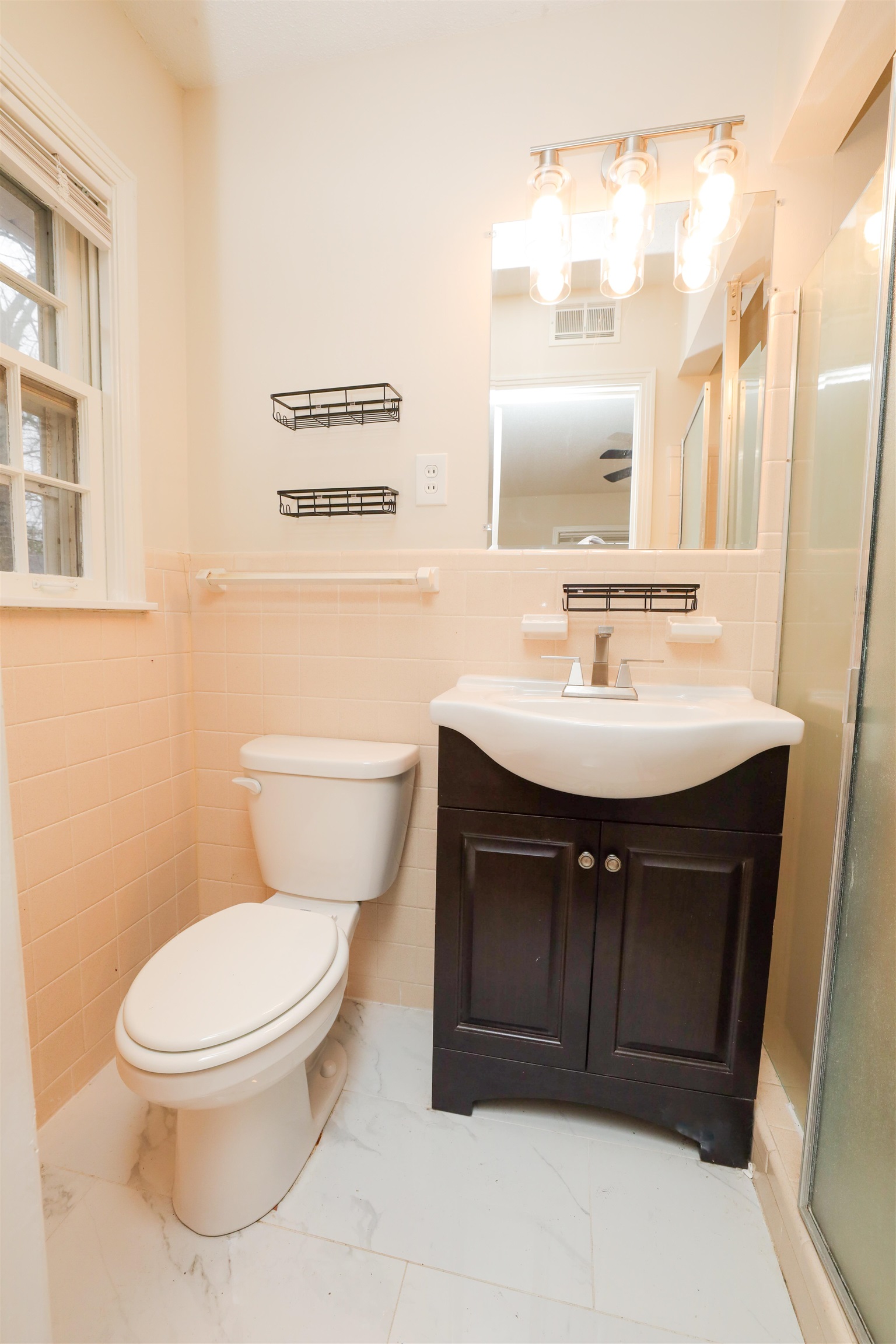 4843 Rolling Fields Drive Memphis, TN 38128 - Photo 10 of 22 Bathroom featuring vanity, a shower with shower door, tile walls, and toilet