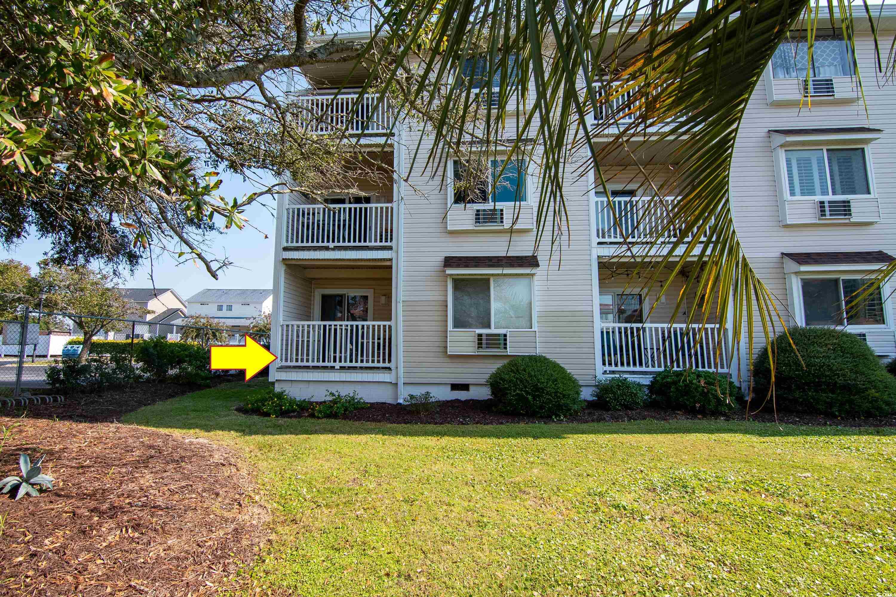 1919 Spring Street, Unit B16 North Myrtle Beach, SC 29582 - Photo 2 of 40 Exterior space featuring a balcony and a yard