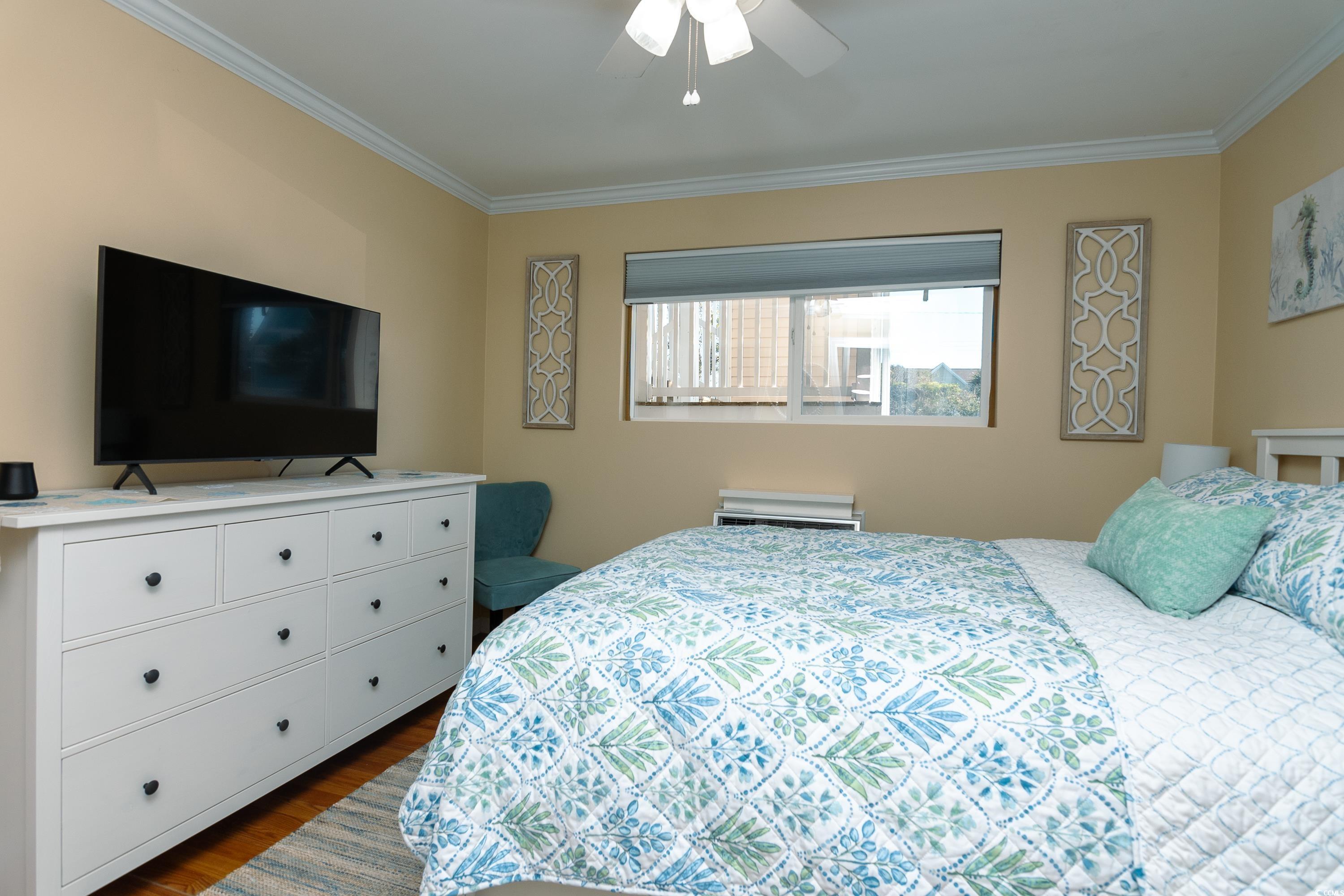 1919 Spring Street, Unit B16 North Myrtle Beach, SC 29582 - Photo 22 of 40 Bedroom featuring dark hardwood / wood-style floor