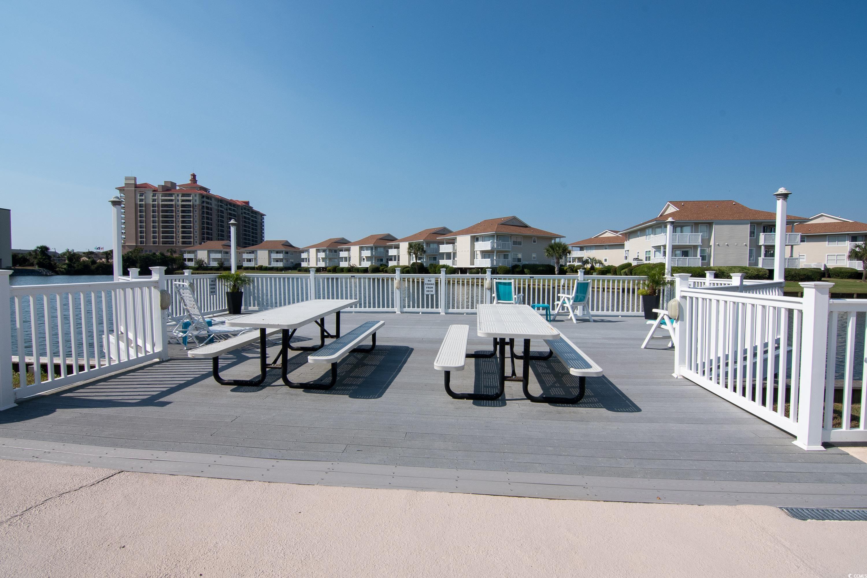 1919 Spring Street, Unit B16 North Myrtle Beach, SC 29582 - Photo 32 of 40 View of patio with a wooden deck