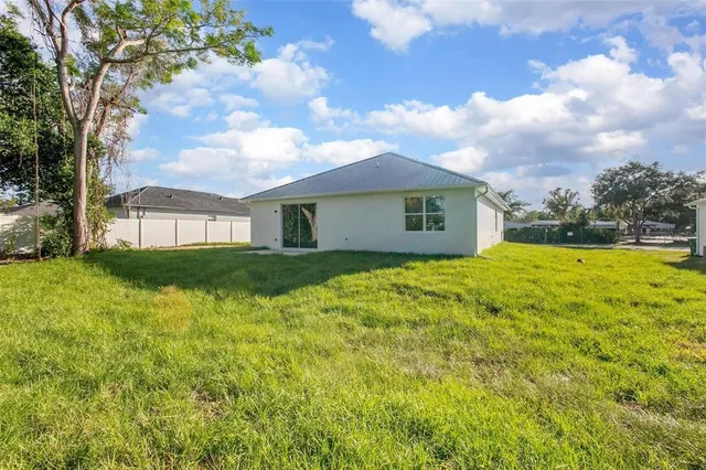 a view of a house with a big yard