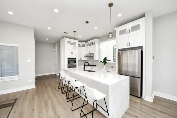 a bathroom with a double vanity sink and mirror