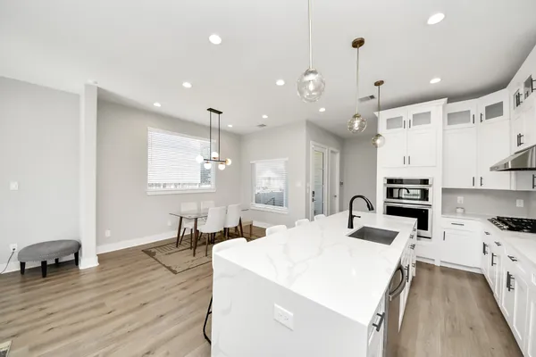 a view of a backyard with wooden fence