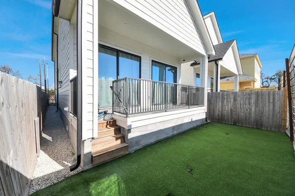 a kitchen with stainless steel appliances kitchen island granite countertop a kitchen island and chairs in it