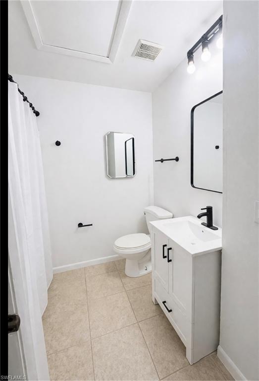 5424 16th Place Southwest, Unit C3 Naples, FL 34116 - Photo 4 of 7 a bathroom with a toilet sink and mirror