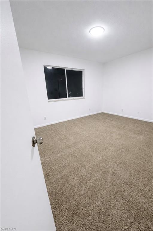 5424 16th Place Southwest, Unit C3 Naples, FL 34116 - Photo 5 of 7 an empty room with a empty space