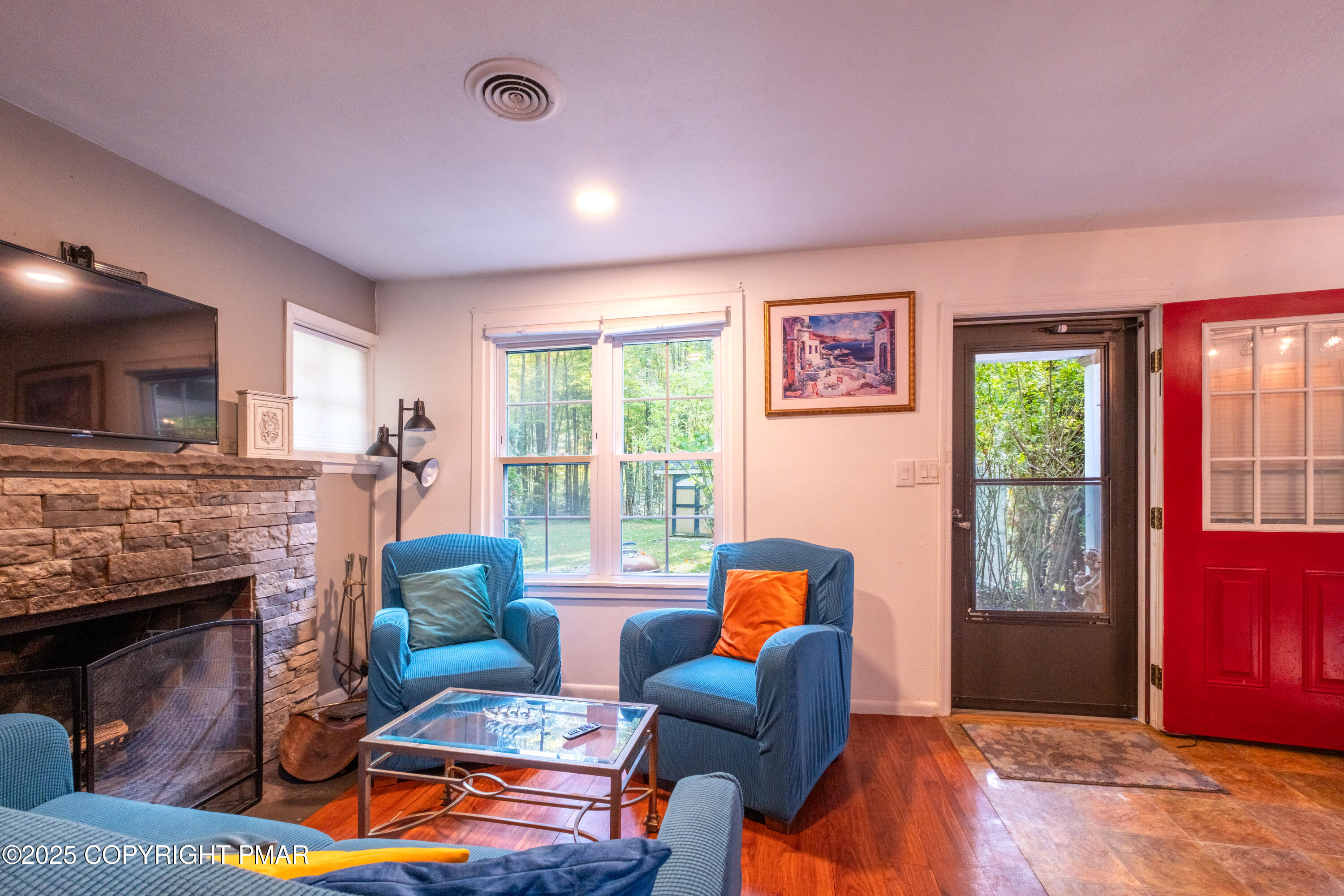1885 Sullivan Trail Tannersville, PA 18372 - Photo 12 of 46 a living room with furniture a flat screen tv and a fireplace