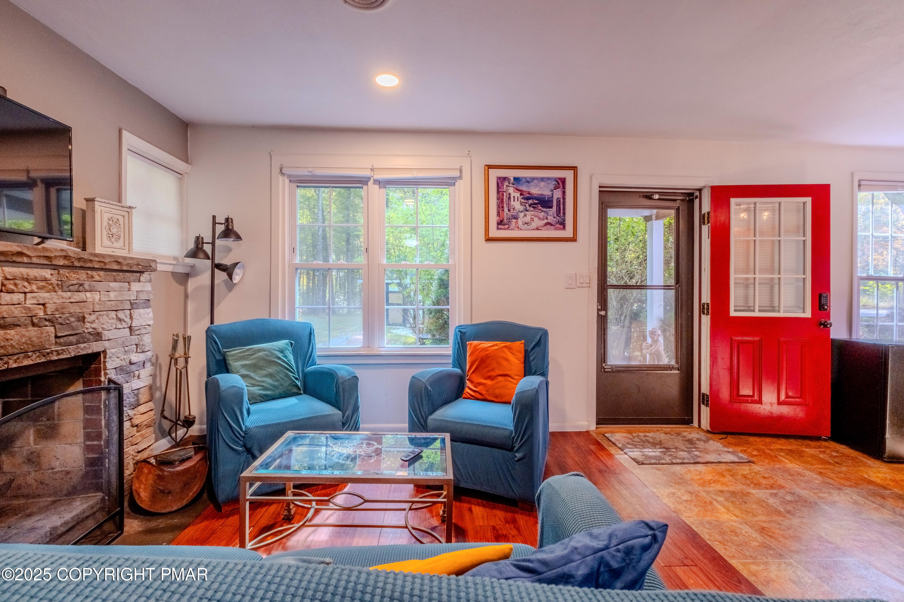1885 Sullivan Trail Tannersville, PA 18372 - Photo 13 of 46 a living room with furniture a rug and a fireplace