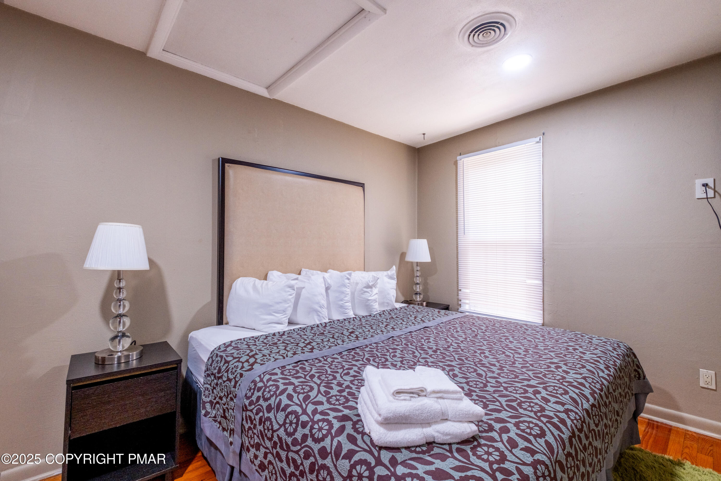 1885 Sullivan Trail Tannersville, PA 18372 - Photo 15 of 46 a bedroom with a bed and a lamp