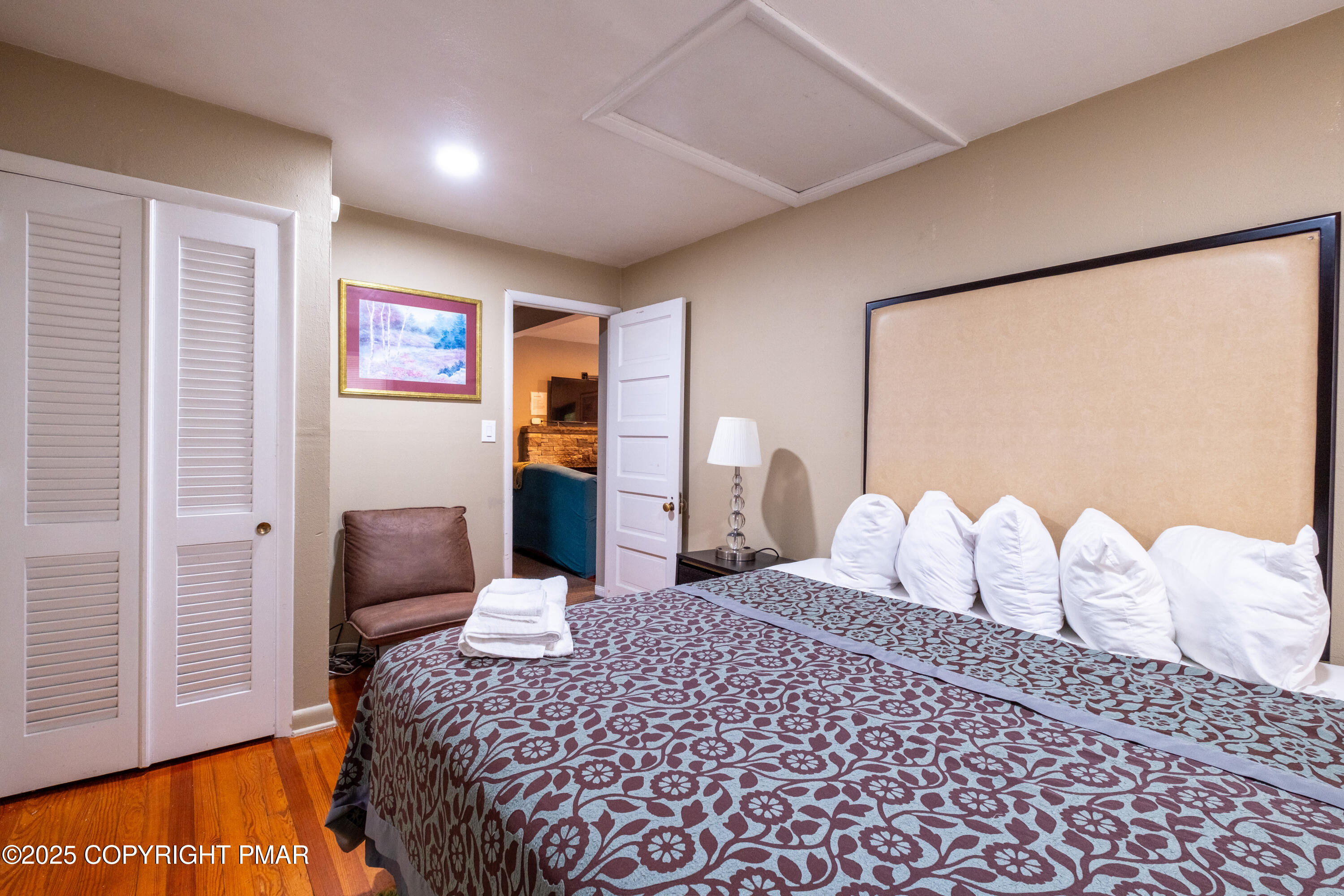 1885 Sullivan Trail Tannersville, PA 18372 - Photo 16 of 46 a bedroom with a bed and a painting on the wall