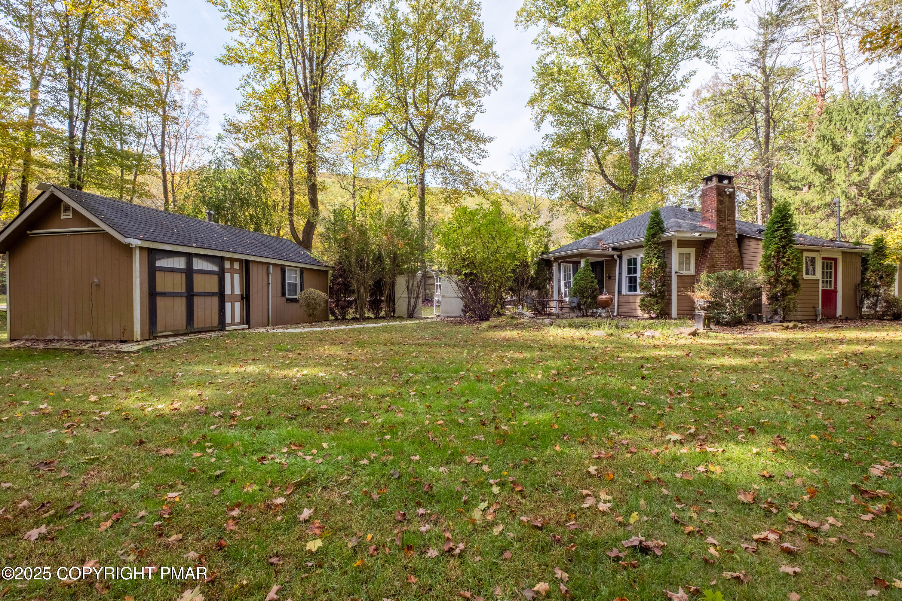1885 Sullivan Trail Tannersville, PA 18372 - Photo 2 of 46 a front view of a house with a yard