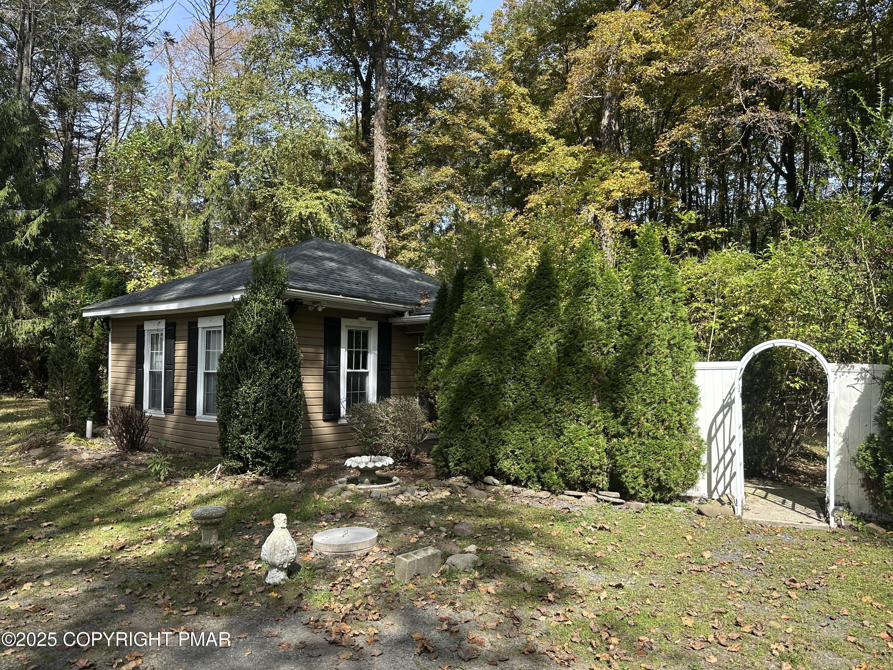 1885 Sullivan Trail Tannersville, PA 18372 - Photo 3 of 46 a front view of a house with garden