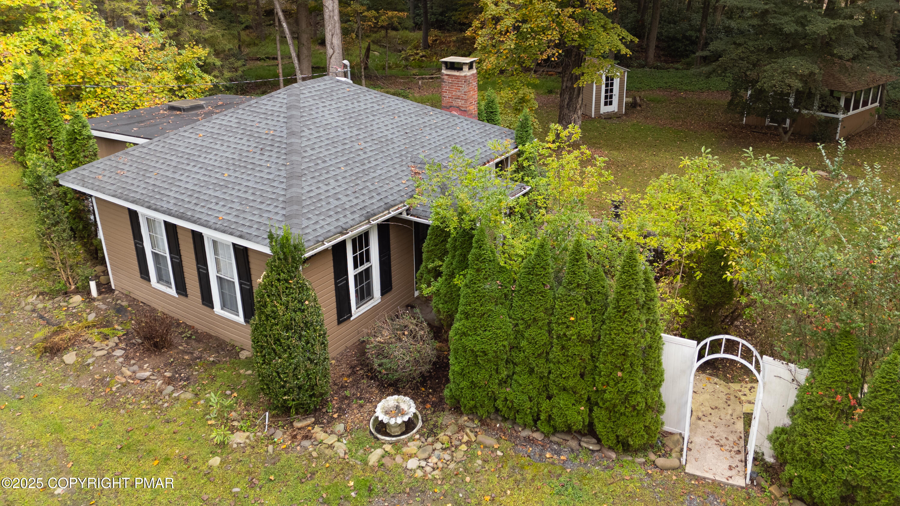 1885 Sullivan Trail Tannersville, PA 18372 - Photo 4 of 46 a aerial view of a house with swimming pool next to a yard