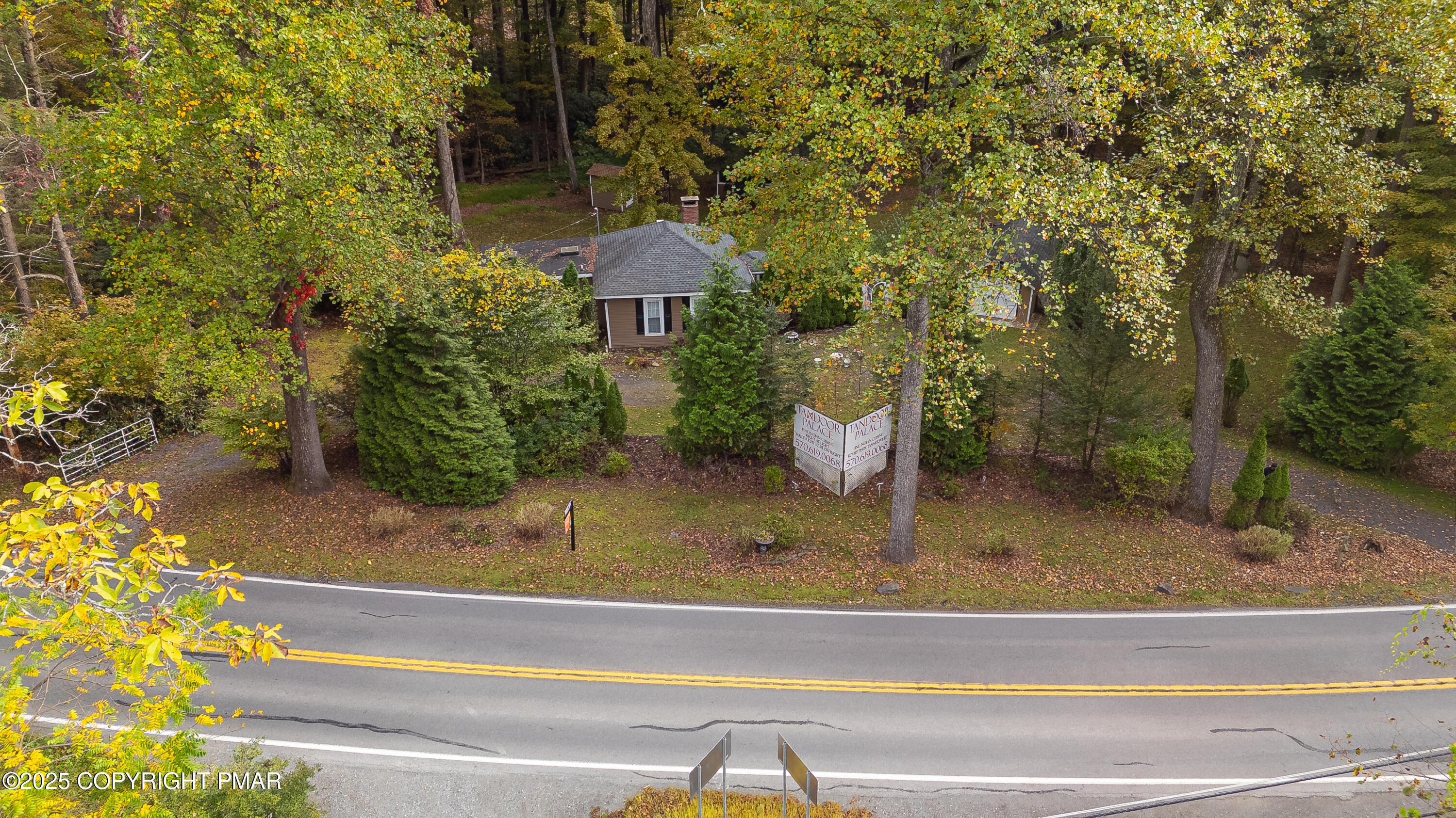1885 Sullivan Trail Tannersville, PA 18372 - Photo 43 of 46 a view of a porch with a table and chairs and potted plants