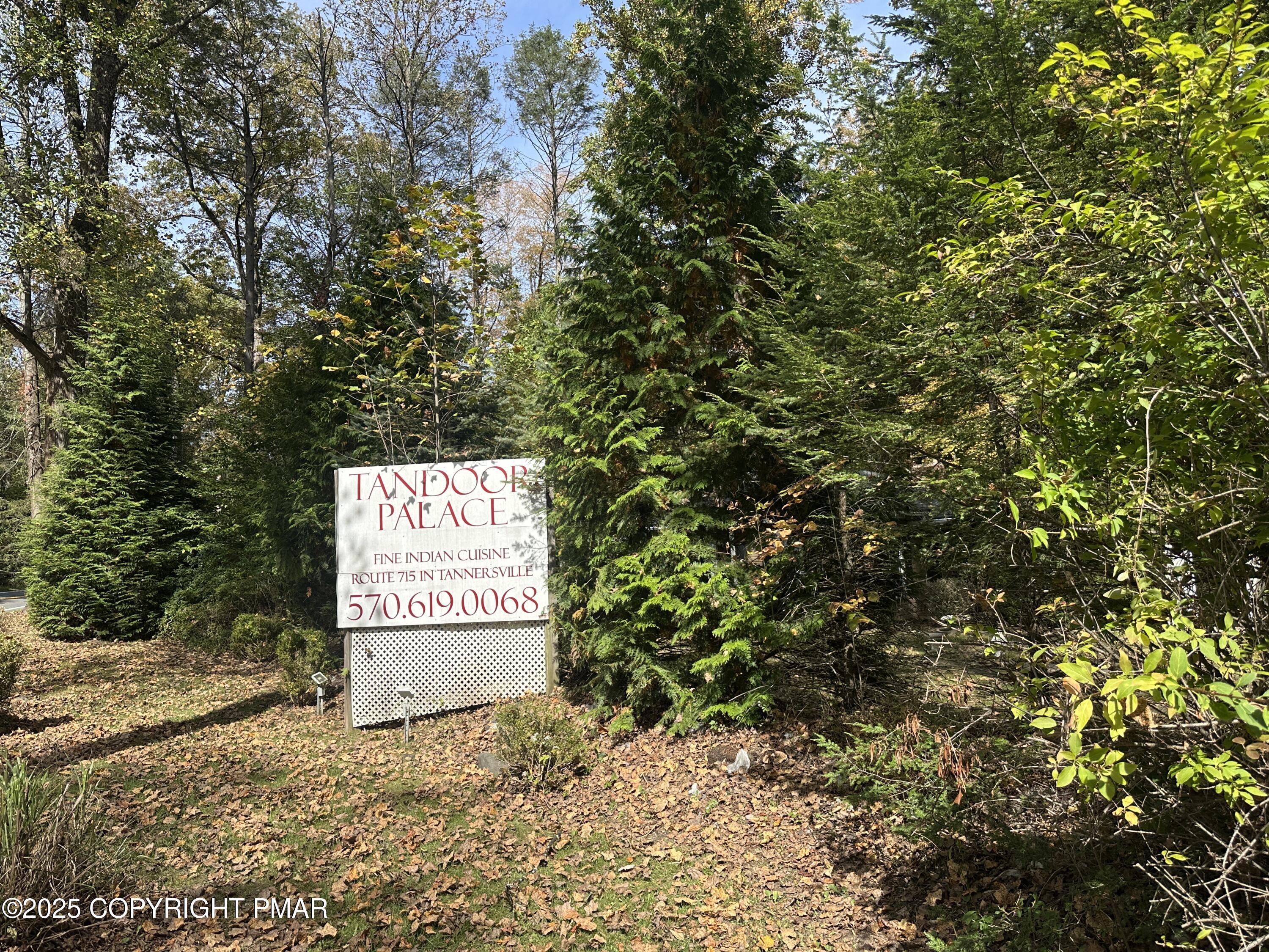 1885 Sullivan Trail Tannersville, PA 18372 - Photo 46 of 46 a sign board with a tree in the background