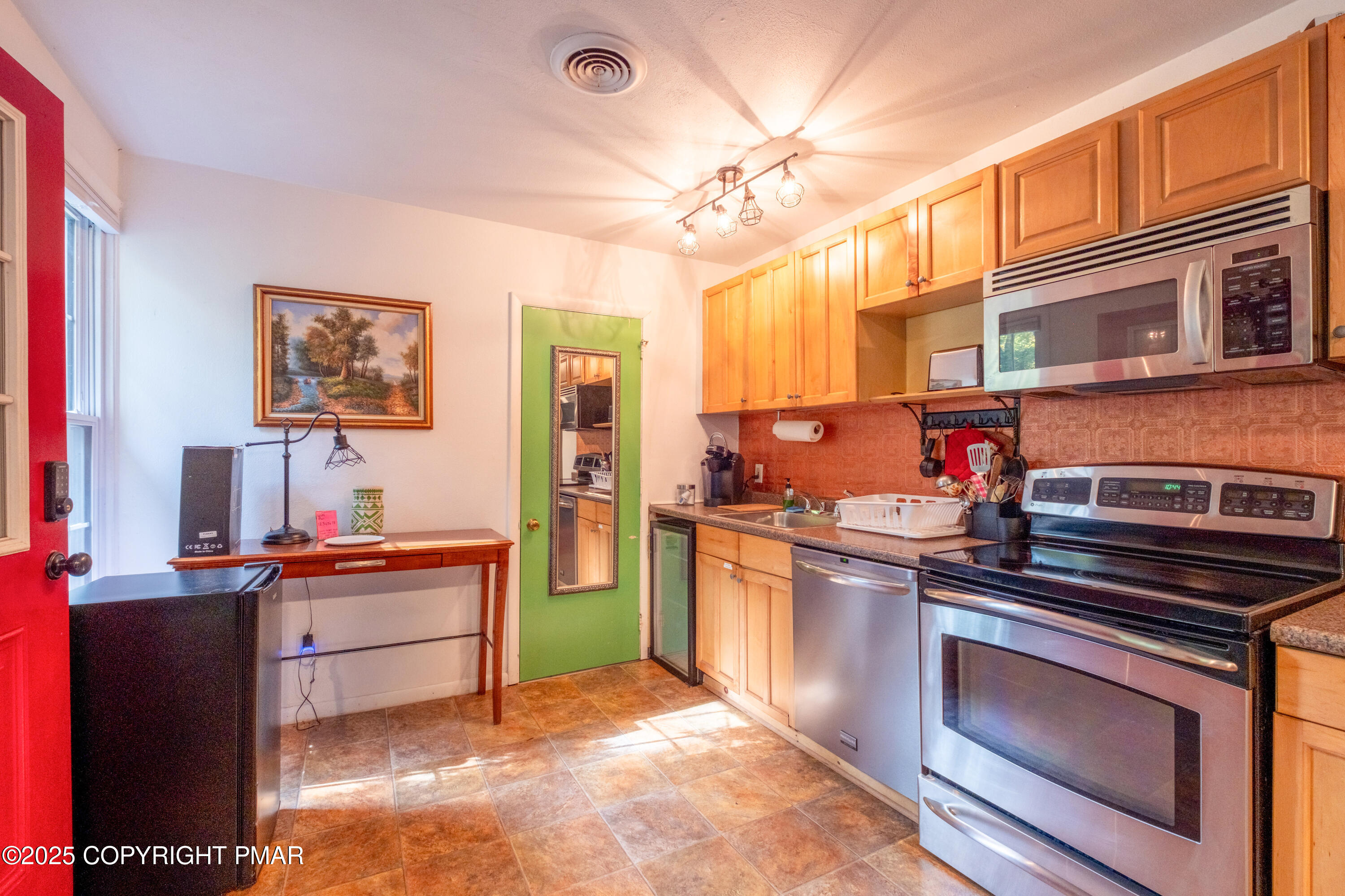 1885 Sullivan Trail Tannersville, PA 18372 - Photo 10 of 46 a kitchen with stainless steel appliances granite countertop a stove and a sink