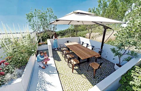 a large kitchen with a table and chairs in it