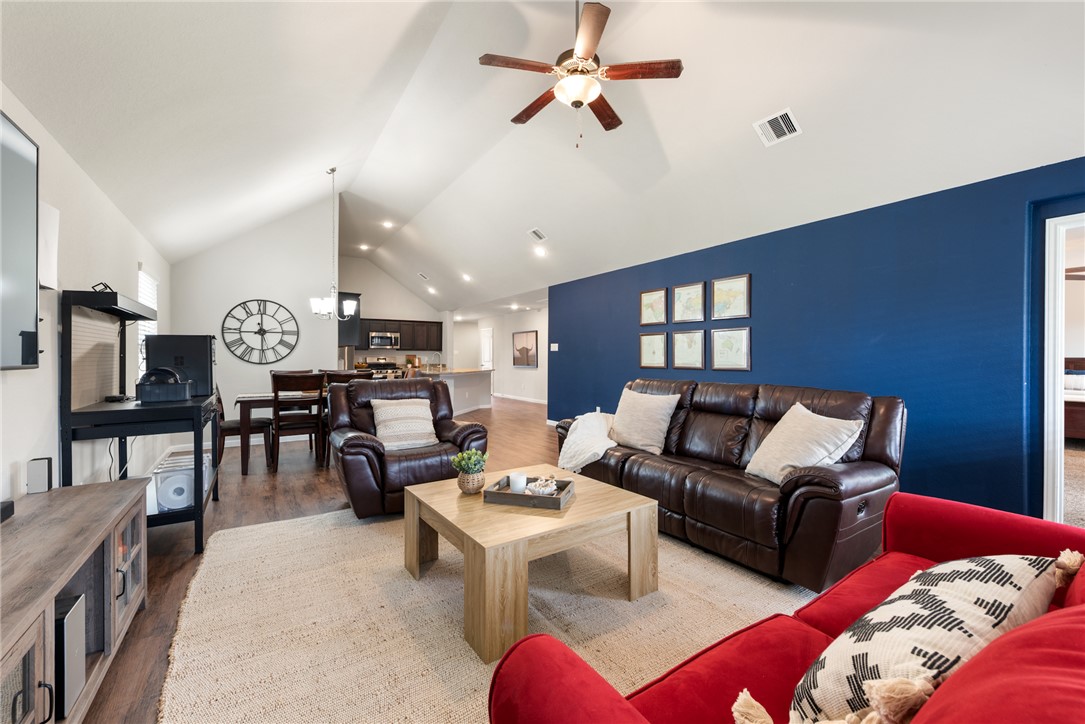 2018 Eagle View Drive Navasota, TX 77868 - Photo 13 of 28 a living room with furniture kitchen view and a chandelier