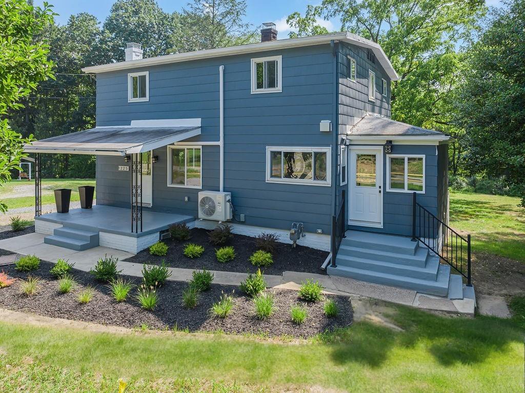 1225 Lovi Road Freedom, PA 15042 - Photo 40 of 41 a front view of a house with garden