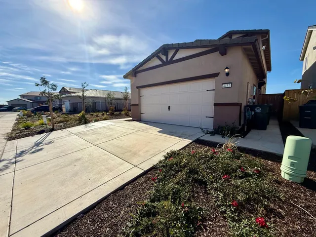 a house with yard in front of it