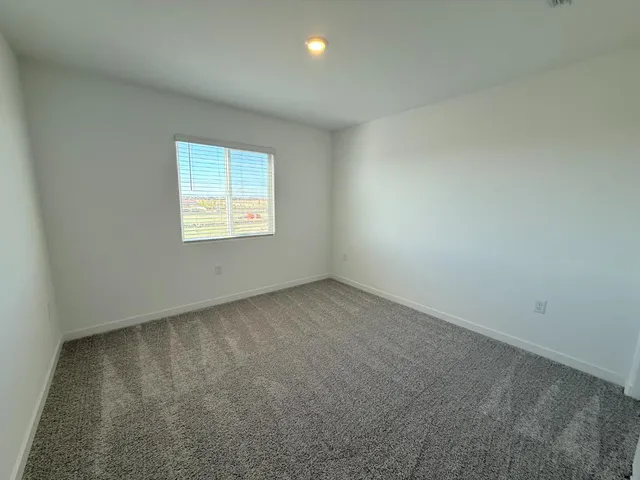 a view of hallway with bathroom