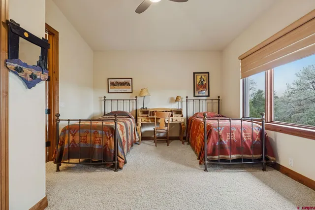 a bedroom with bed and a window