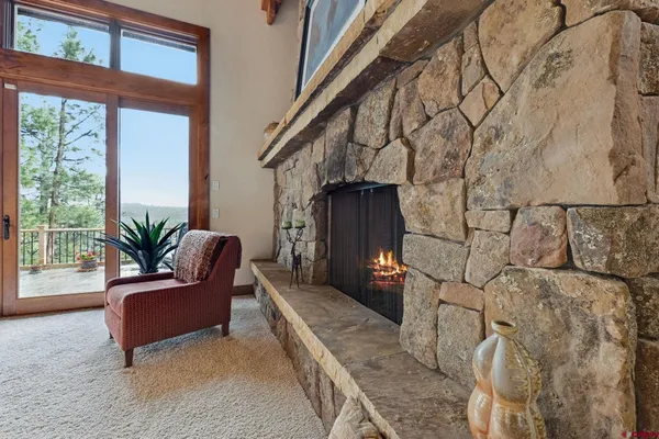 a view of a house with a yard and tree s