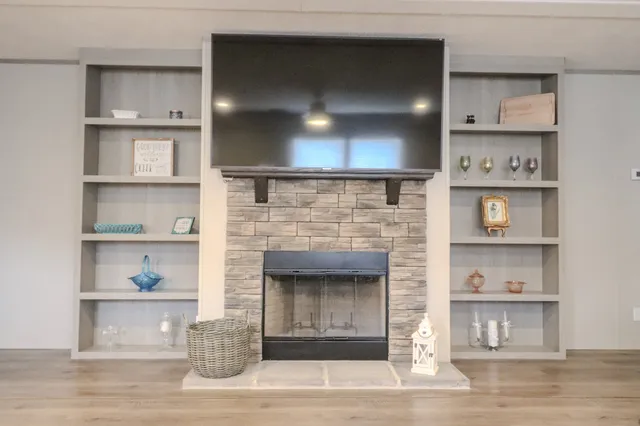 a kitchen that has a lot of white stainless steel appliances