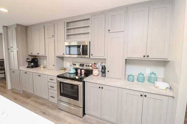 a room with a bed and a wooden floor