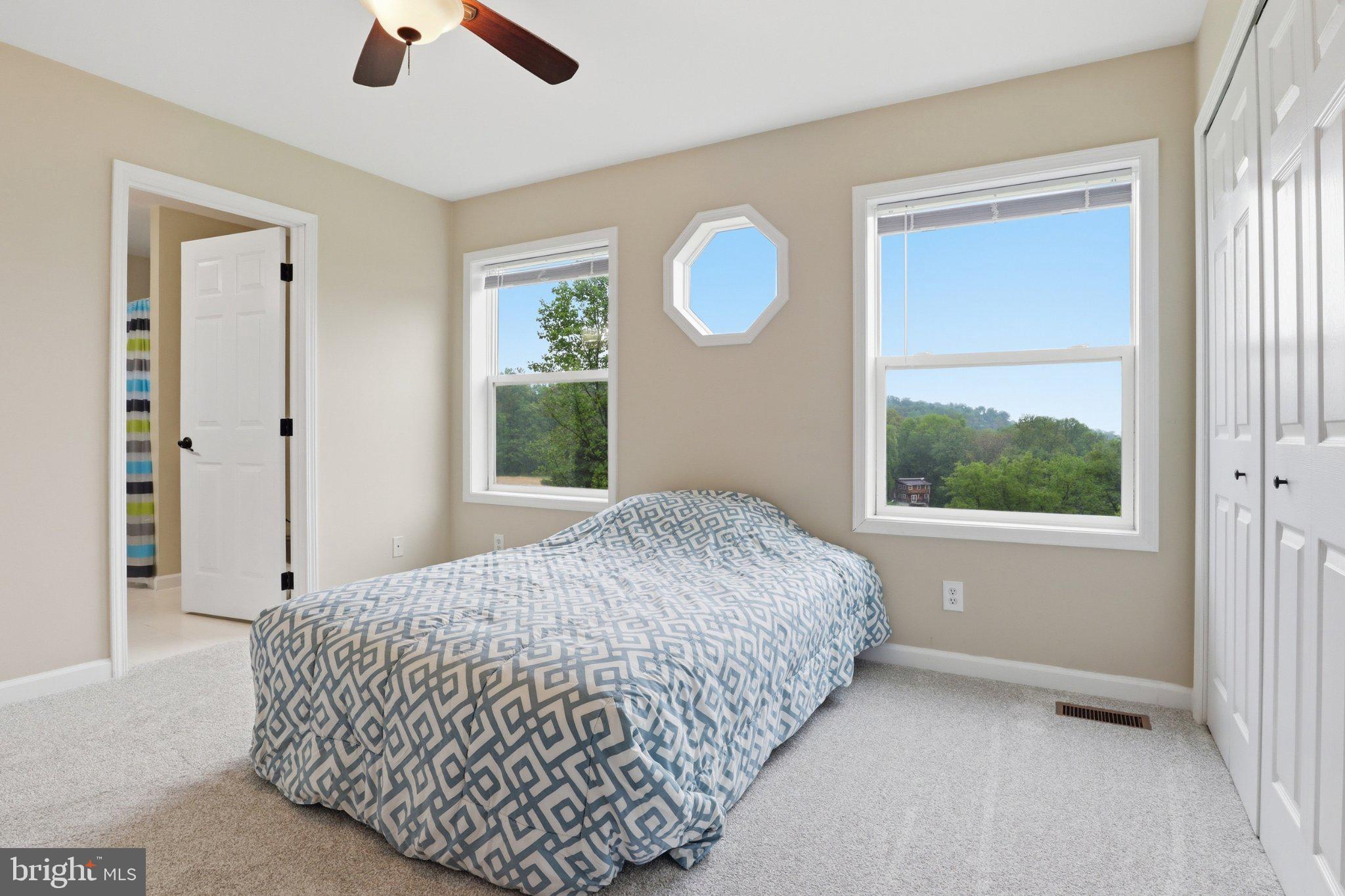 491 Garvine Mill Road Fawn Grove, PA 17321 - Photo 20 of 47 a bedroom with a bed and a window