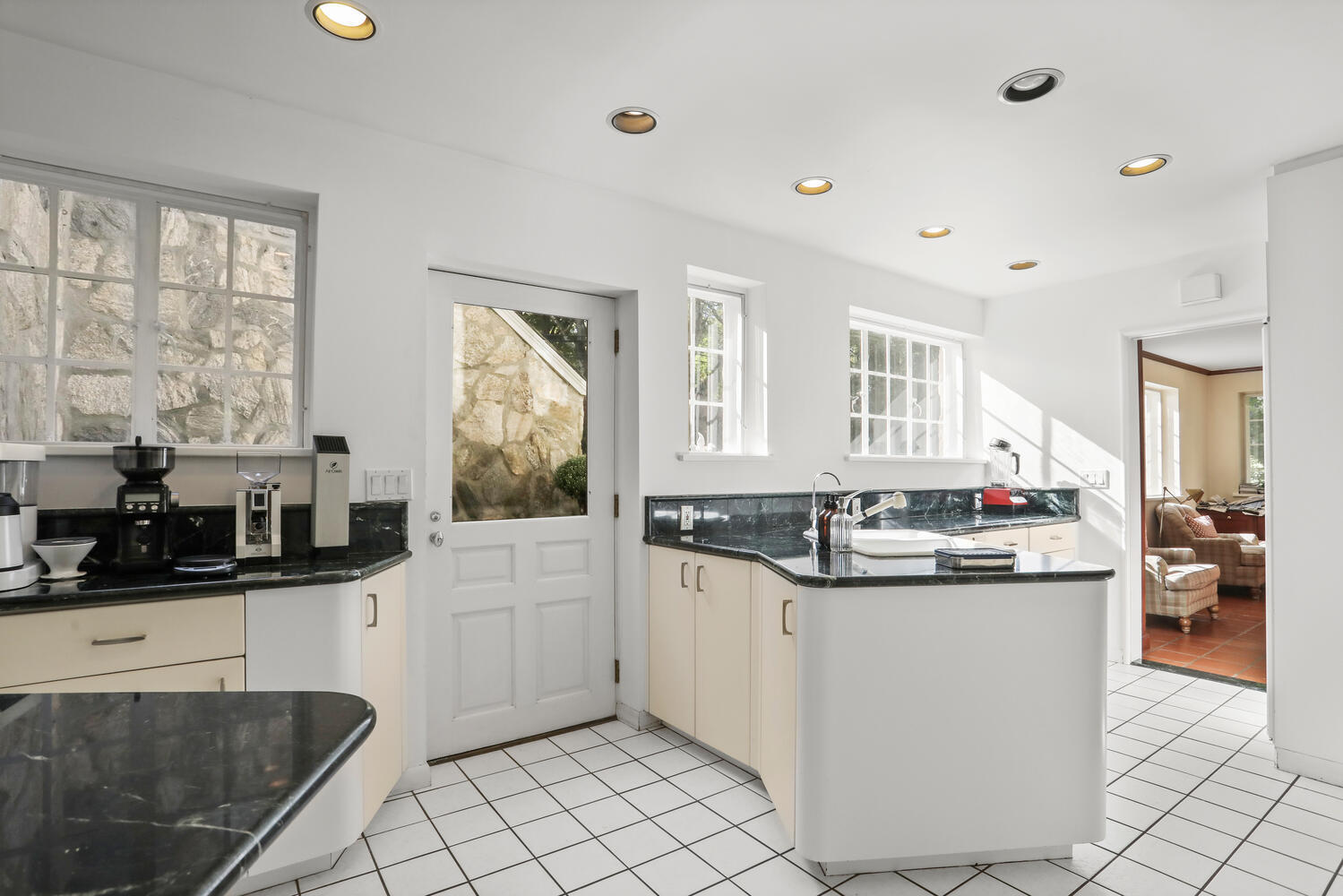 11 Searles Road Darien, CT 06820 - Photo 11 of 43 a kitchen with stainless steel appliances kitchen island granite countertop a stove and cabinets