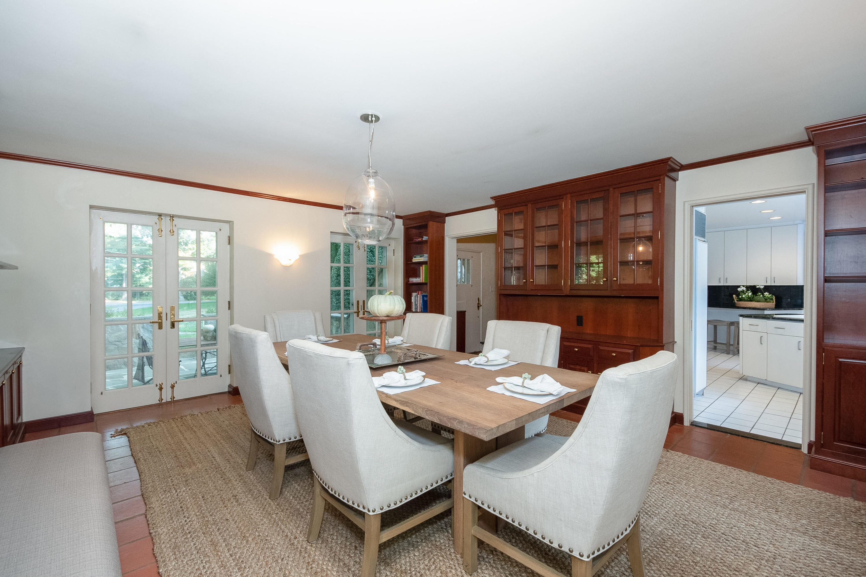 11 Searles Road Darien, CT 06820 - Photo 13 of 43 a view of a dining room with furniture window and wooden floor