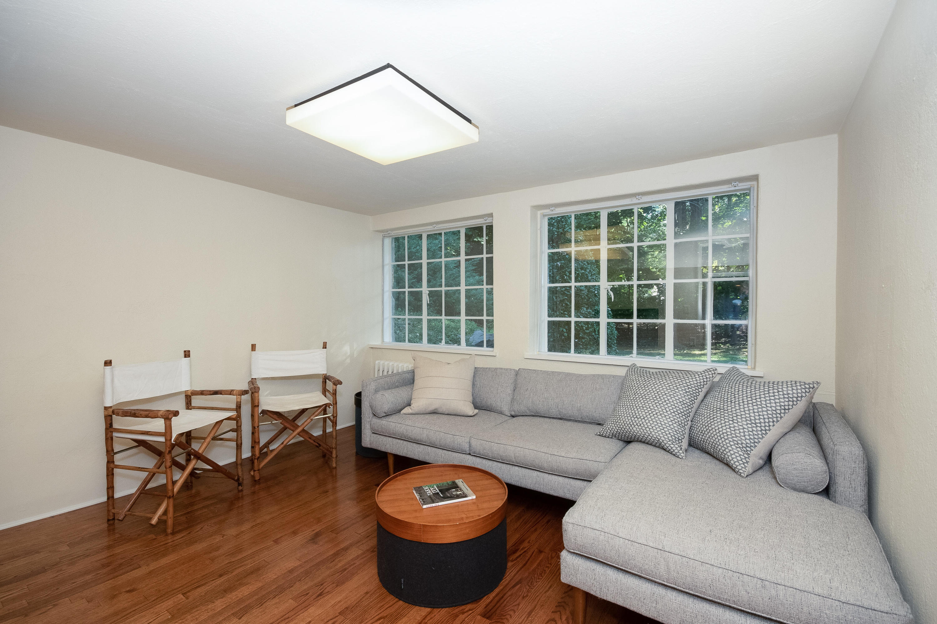 11 Searles Road Darien, CT 06820 - Photo 15 of 43 a living room with furniture and a large window