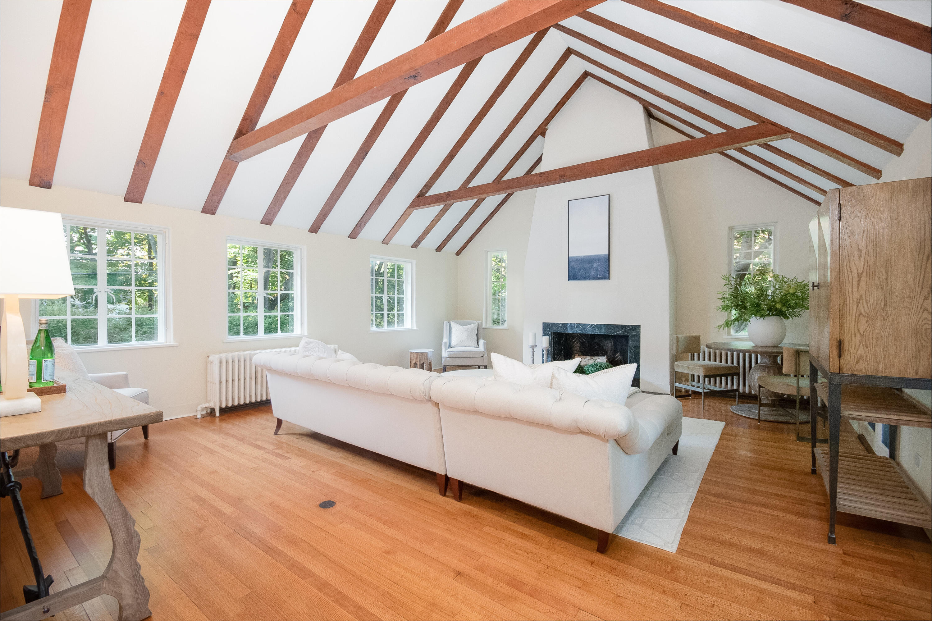 11 Searles Road Darien, CT 06820 - Photo 18 of 43 a living room with furniture a fireplace and a large window