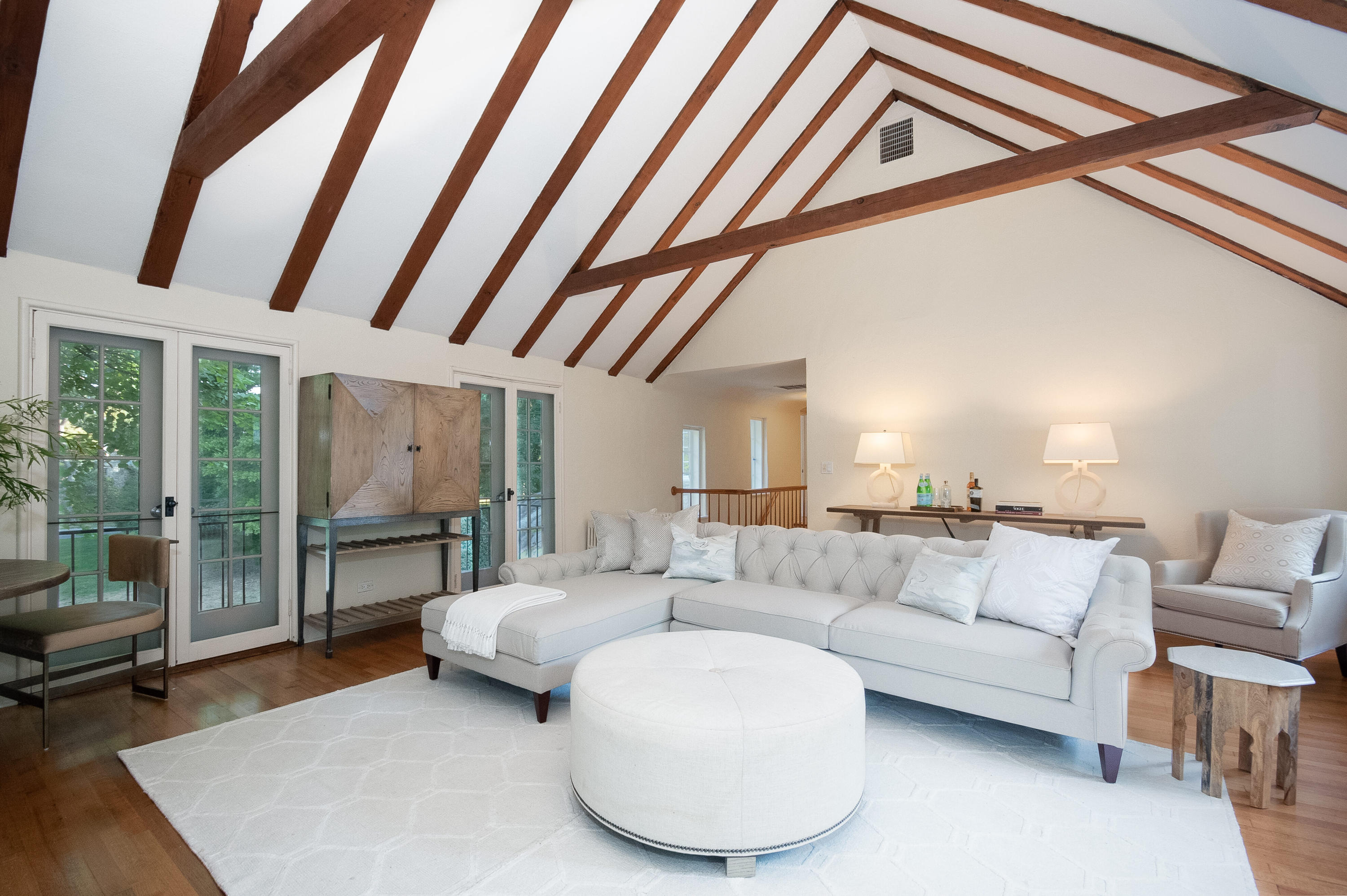 11 Searles Road Darien, CT 06820 - Photo 21 of 43 a living room with furniture and a floor to ceiling window