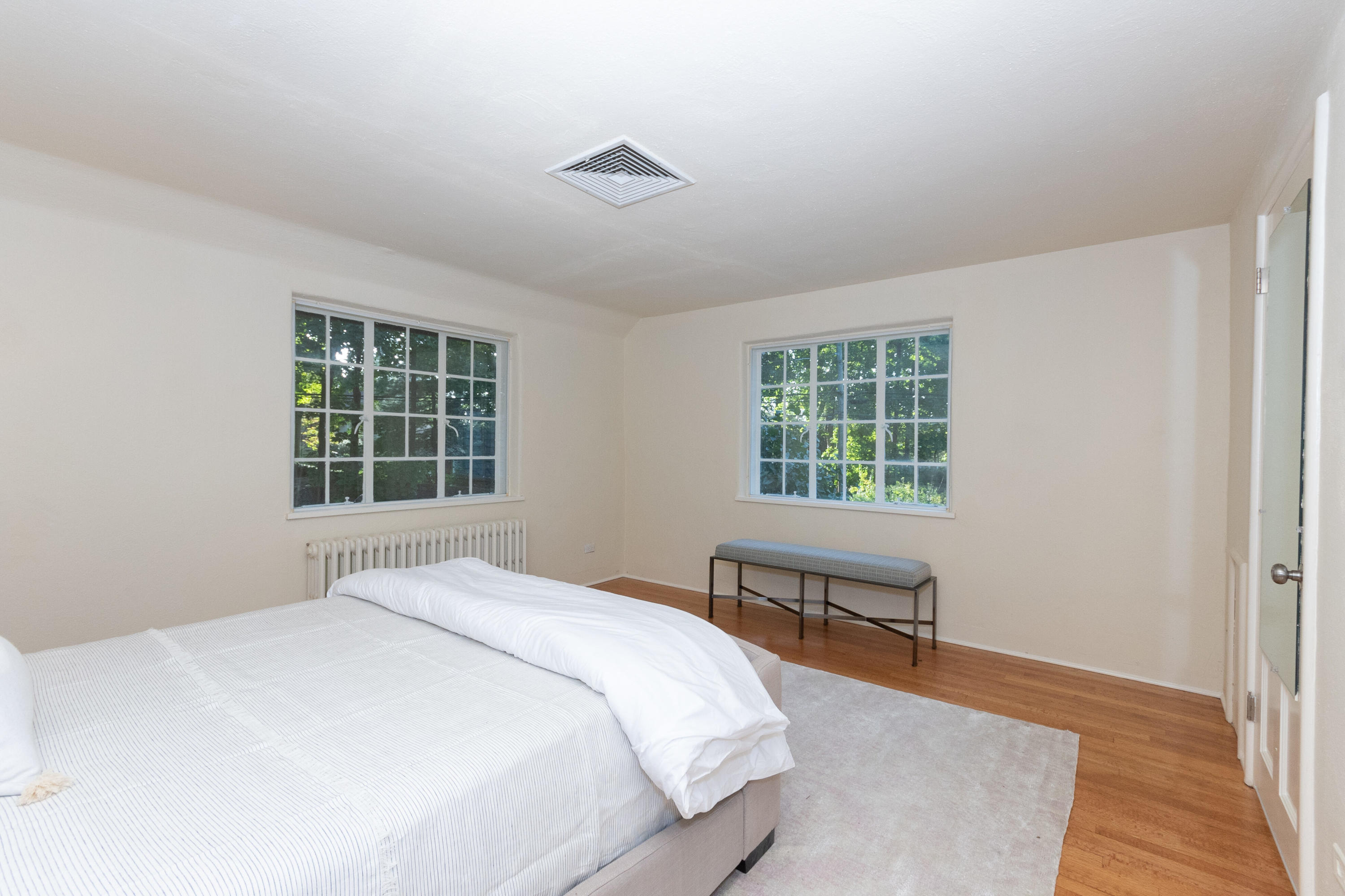 11 Searles Road Darien, CT 06820 - Photo 23 of 43 a bedroom with a bed and a window