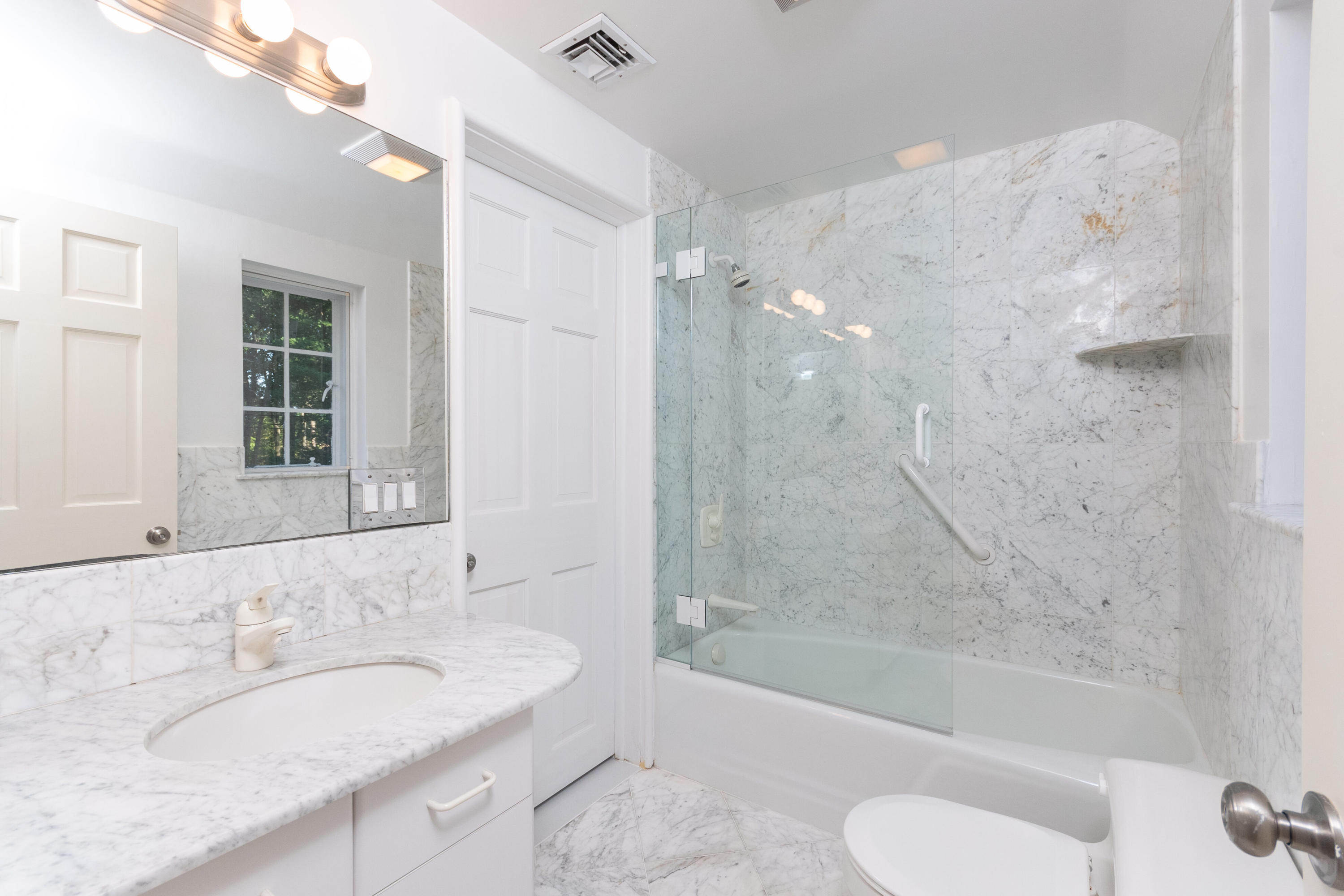 11 Searles Road Darien, CT 06820 - Photo 24 of 43 a bathroom with a granite countertop sink toilet and shower