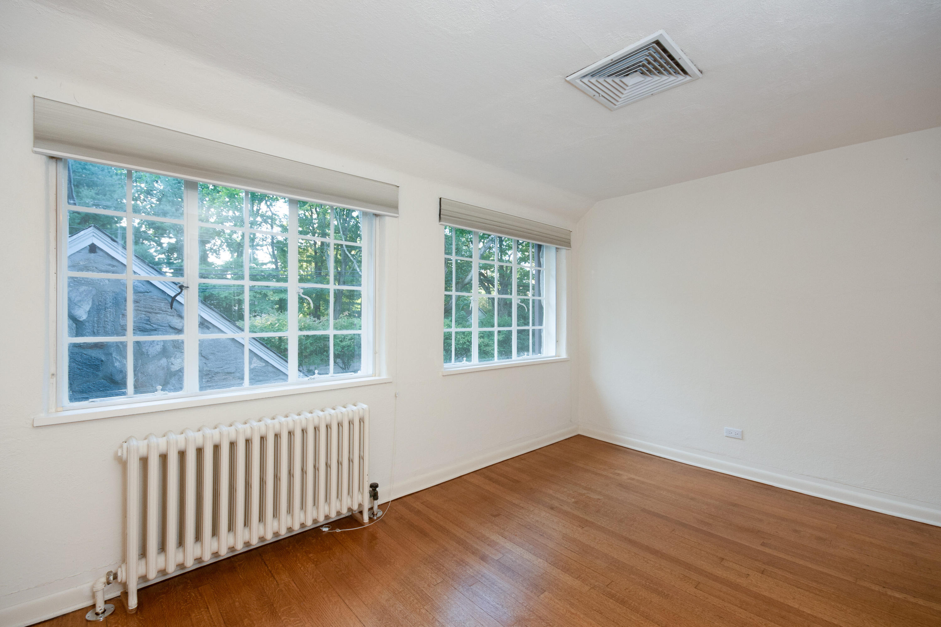 11 Searles Road Darien, CT 06820 - Photo 25 of 43 a view of an empty room with wooden floor and a window