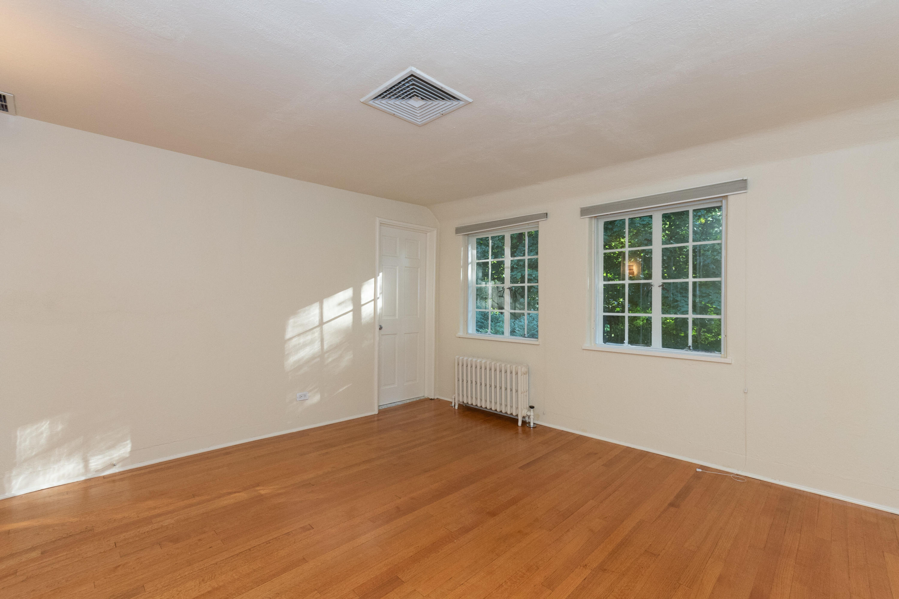 11 Searles Road Darien, CT 06820 - Photo 28 of 43 a view of empty room with wooden floor and fan