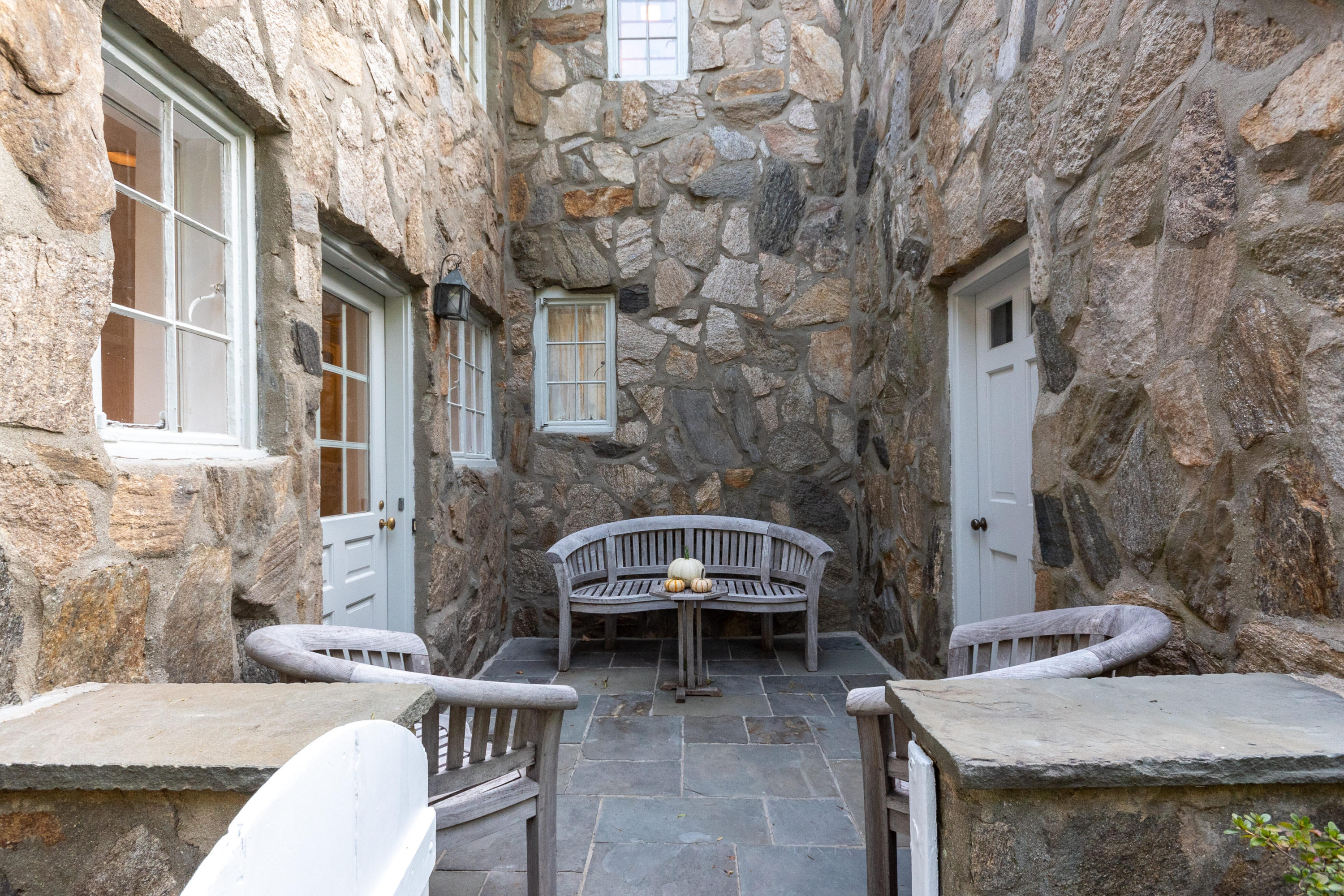 11 Searles Road Darien, CT 06820 - Photo 33 of 43 a view of a patio with couches and table and potted plants