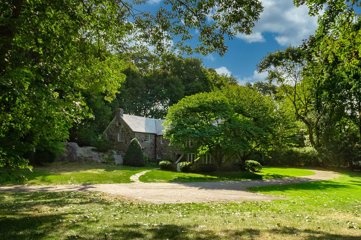 11 Searles Road Darien, CT 06820 - Photo 37 of 43 a view of a backyard with a fountain