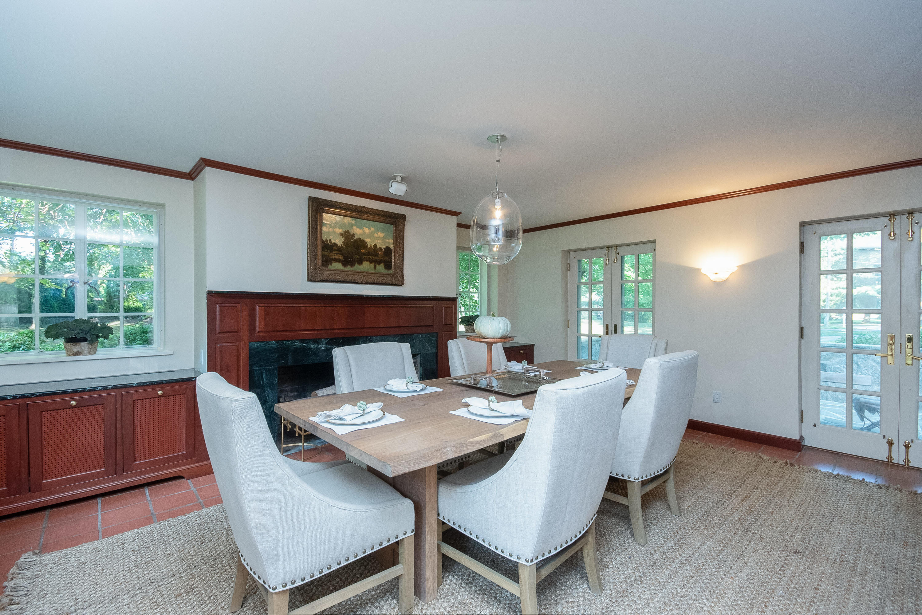 11 Searles Road Darien, CT 06820 - Photo 10 of 43 a view of a dining room with furniture window and wooden floor