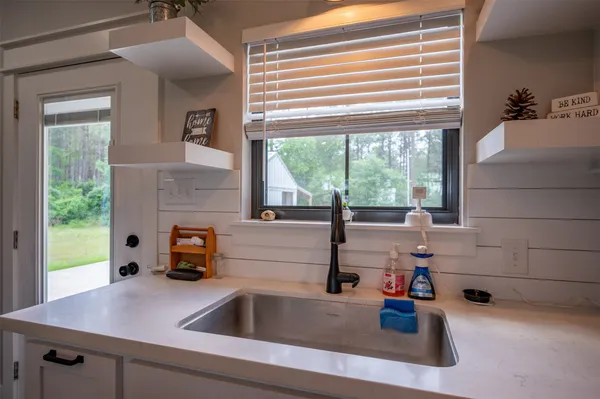 a kitchen with a sink and a window